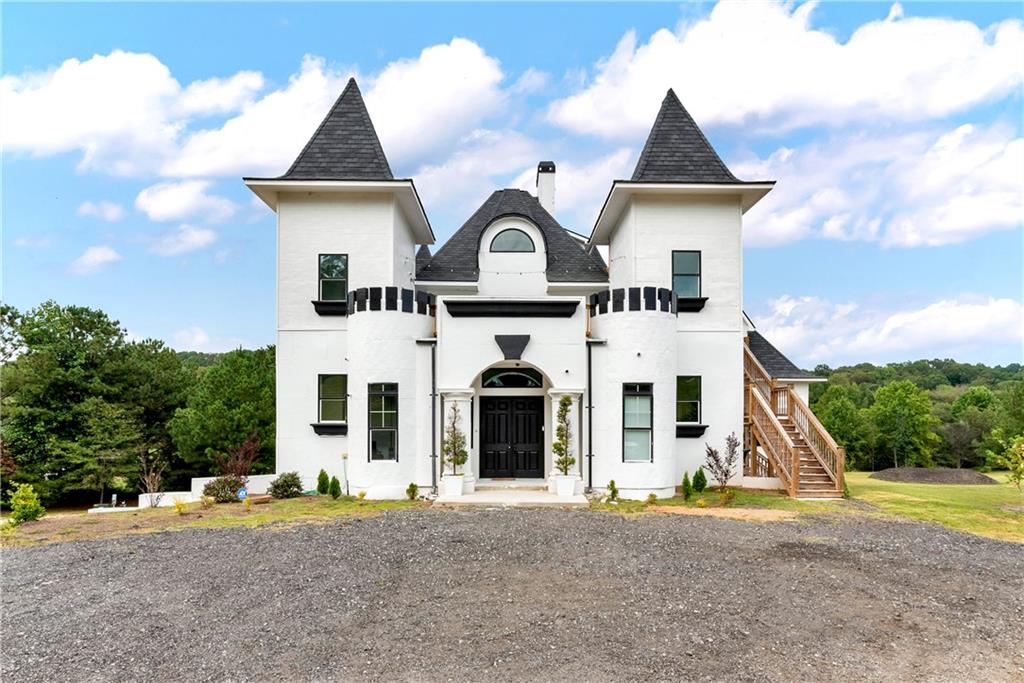 1197 Dee Kennedy Road Auburn, GA 30011 - Photo 61 of 78 front view of a house with a yard