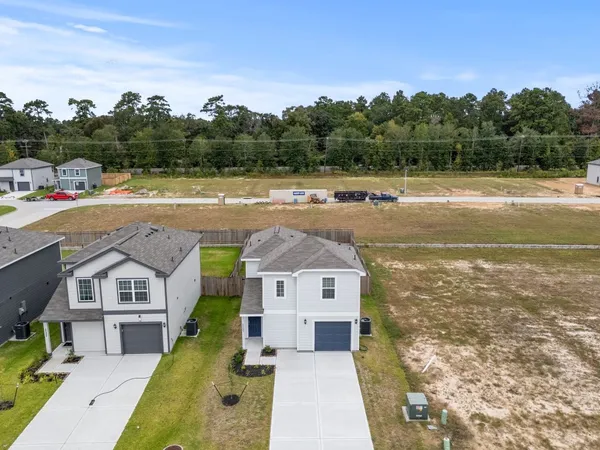 a view of a house with a swimming pool with a yard