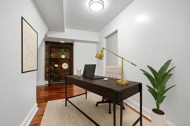 a workspace with furniture and wooden floor