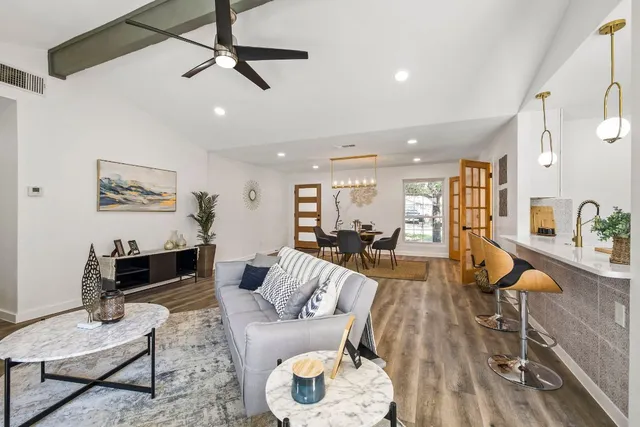a living room with furniture and a table