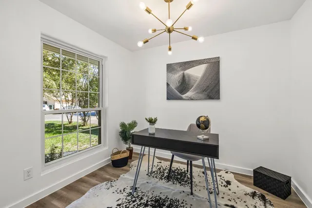 a workspace with furniture and a window