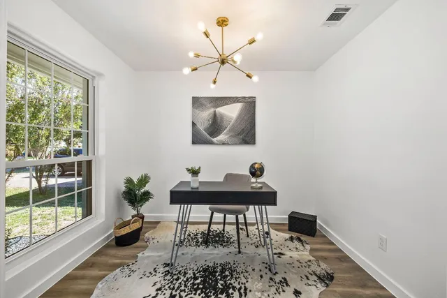 a workspace with furniture and window