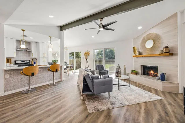 a living room with furniture and a fireplace