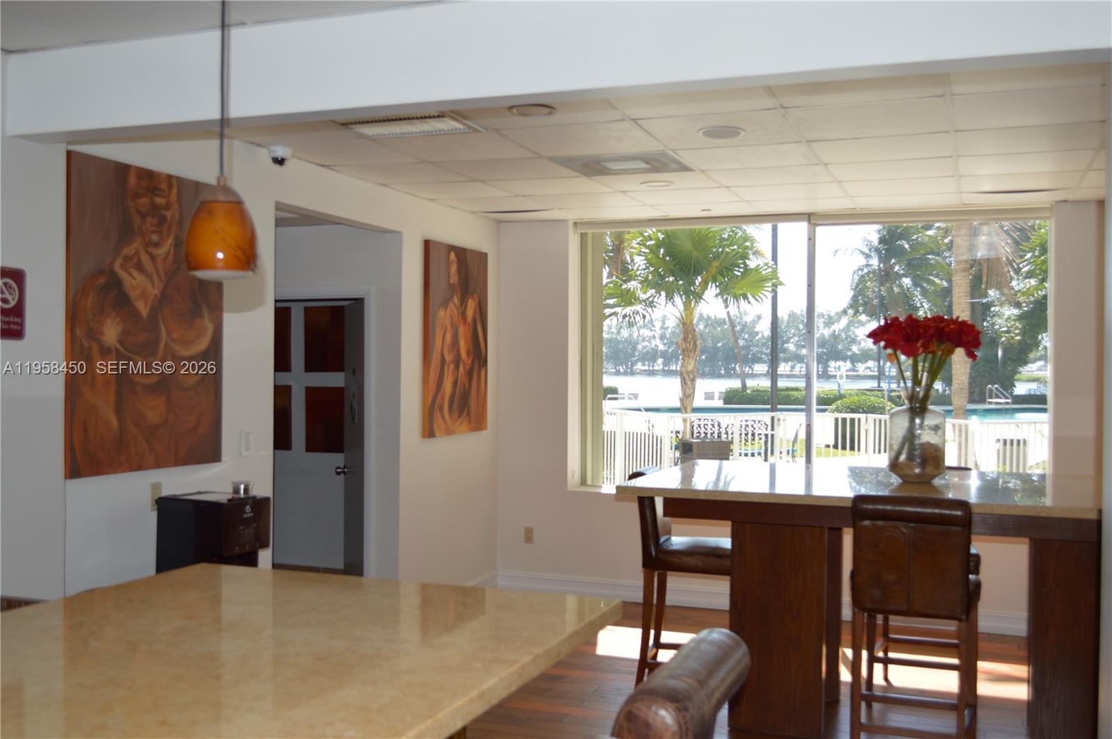2451 Brickell Avenue, Unit PHM Miami, FL 33129 - Photo 14 of 52 a view of a dining room with furniture window and outside view