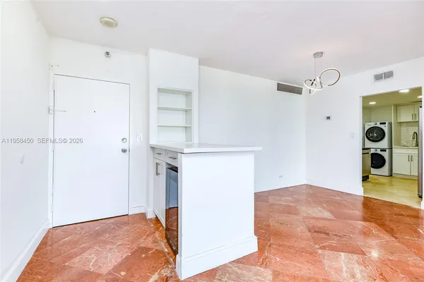 a view of a big room with closet and mirror