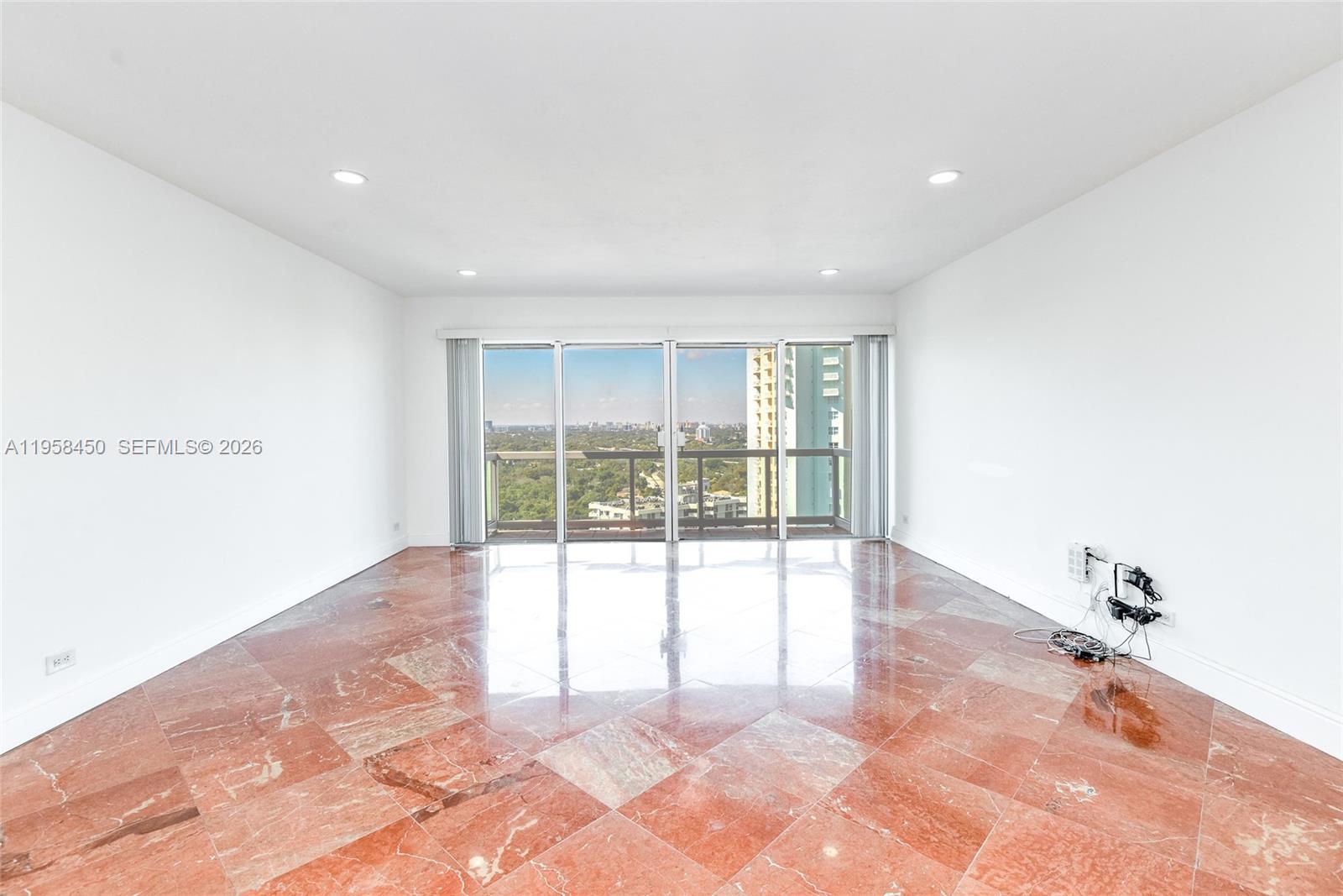 2451 Brickell Avenue, Unit PHM Miami, FL 33129 - Photo 17 of 40 a view of an empty room with a window