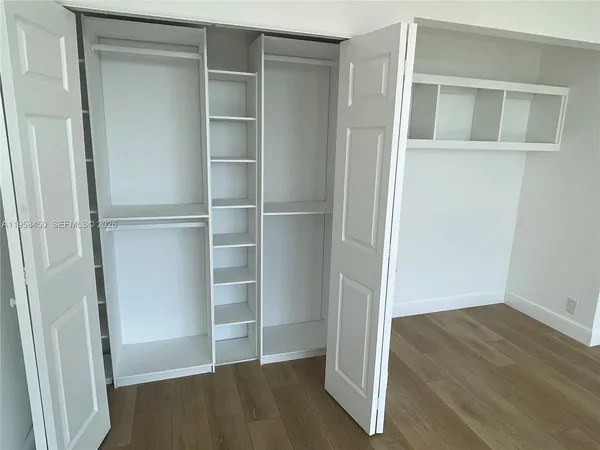 a view of an empty walk in closet