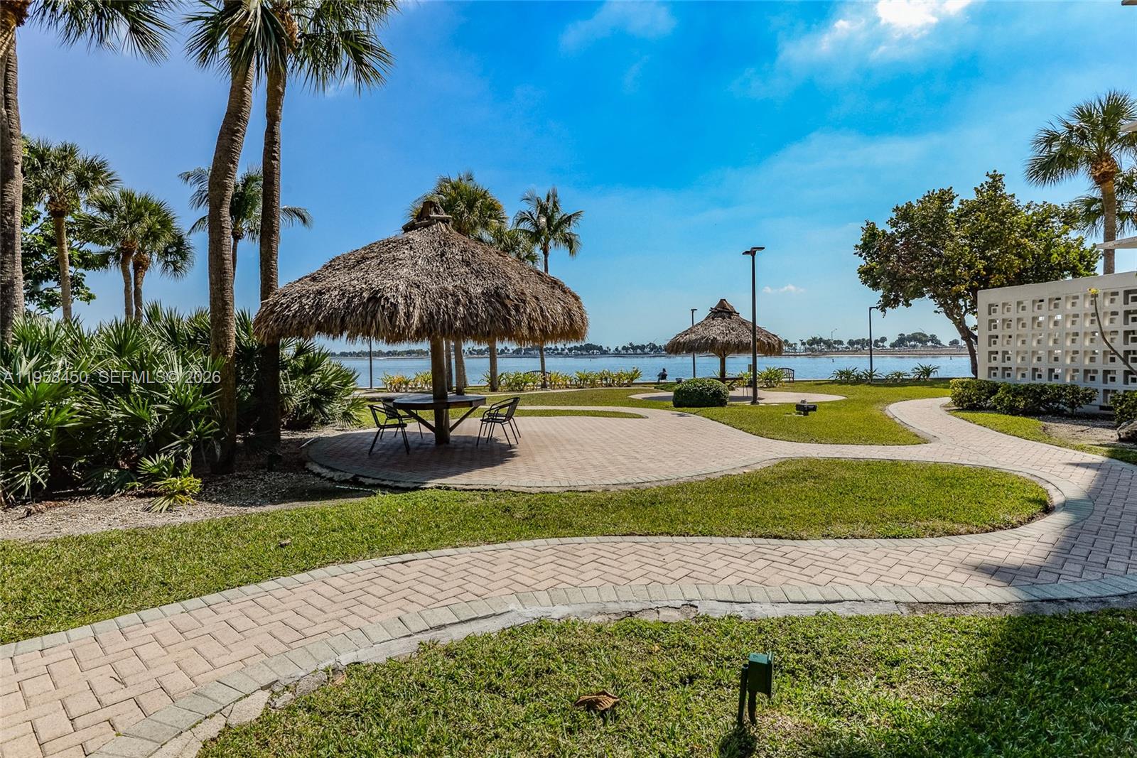 2451 Brickell Avenue, Unit PHM Miami, FL 33129 - Photo 37 of 40 a view of a house with swimming pool and a yard