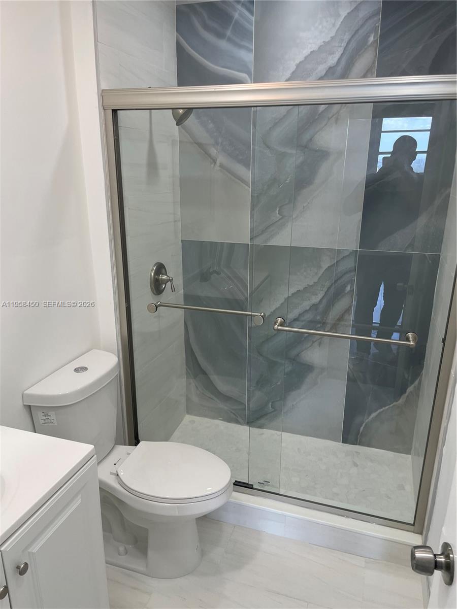 2451 Brickell Avenue, Unit PHM Miami, FL 33129 - Photo 46 of 52 a bathroom with a toilet and a shower