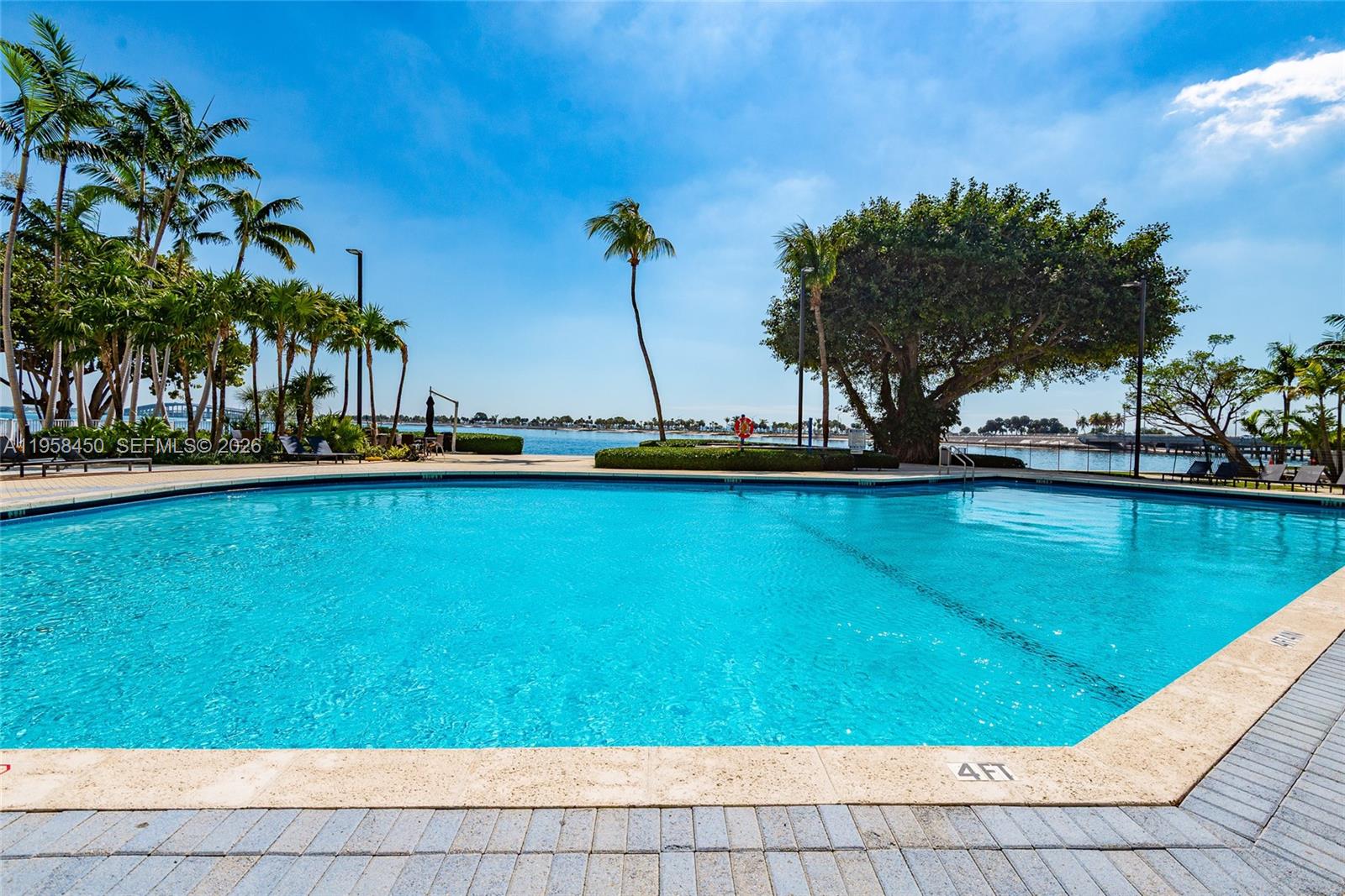 2451 Brickell Avenue, Unit PHM Miami, FL 33129 - Photo 10 of 40 a view of swimming pool with a yard and trees