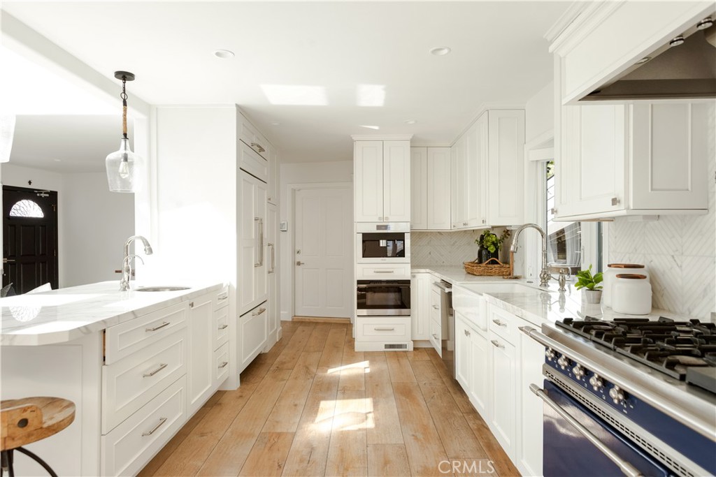 781 Summit Drive Laguna Beach, CA 92651 - Photo 18 of 73 a kitchen with stainless steel appliances a stove a sink and a refrigerator