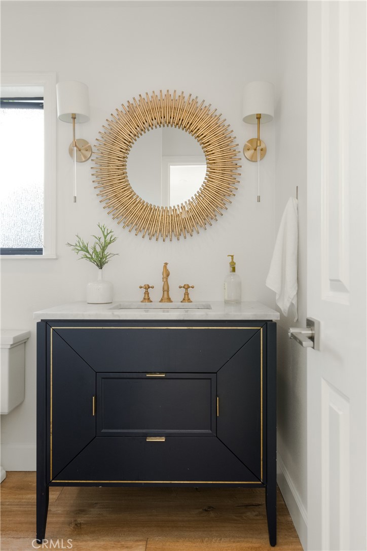 781 Summit Drive Laguna Beach, CA 92651 - Photo 25 of 73 a bathroom with a sink a mirror and vanity