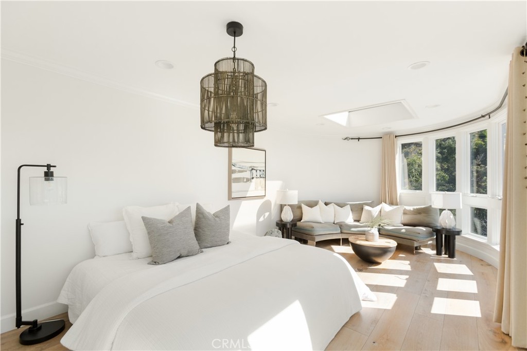 781 Summit Drive Laguna Beach, CA 92651 - Photo 28 of 73 a bedroom with furniture and a window