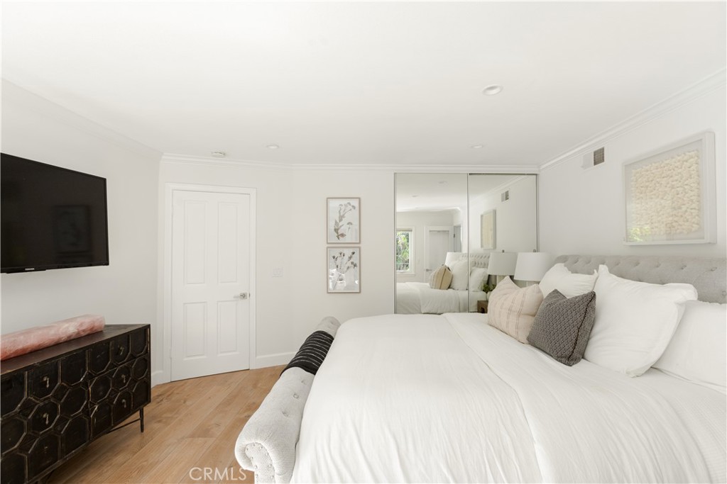 781 Summit Drive Laguna Beach, CA 92651 - Photo 37 of 73 a bedroom with a bed and a flat screen tv