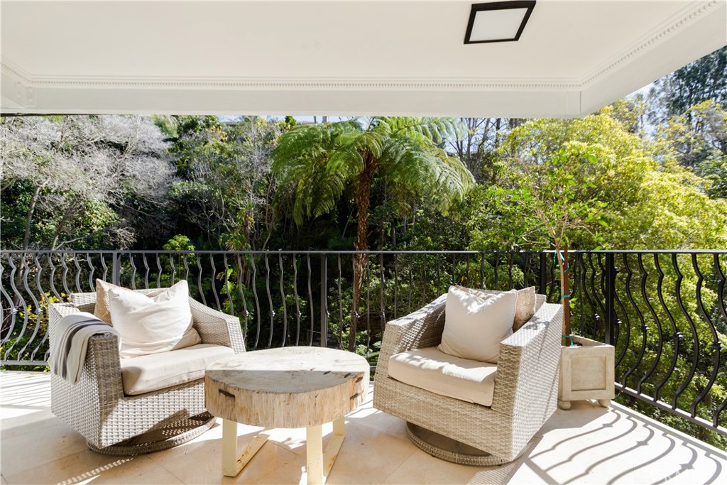 781 Summit Drive Laguna Beach, CA 92651 - Photo 39 of 73 a balcony with wooden floor and outdoor seating