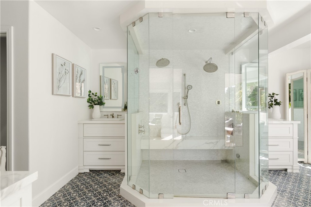 781 Summit Drive Laguna Beach, CA 92651 - Photo 43 of 73 a bathroom with a glass shower door