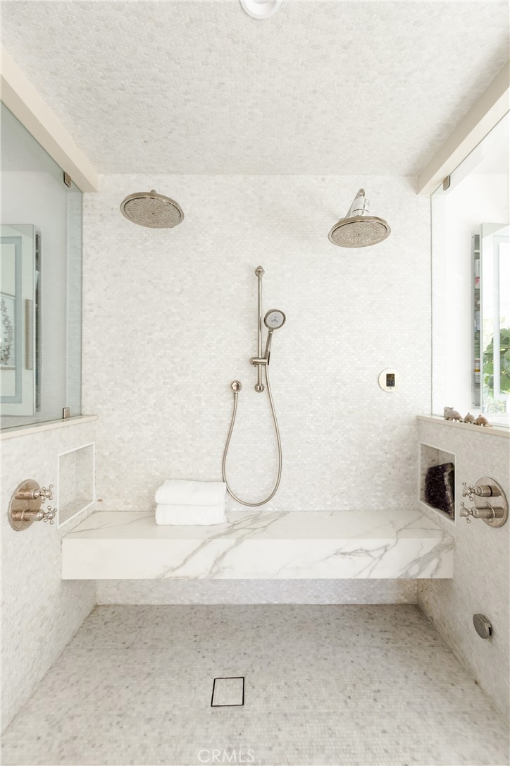 781 Summit Drive Laguna Beach, CA 92651 - Photo 44 of 73 a bathroom with a sink and mirror