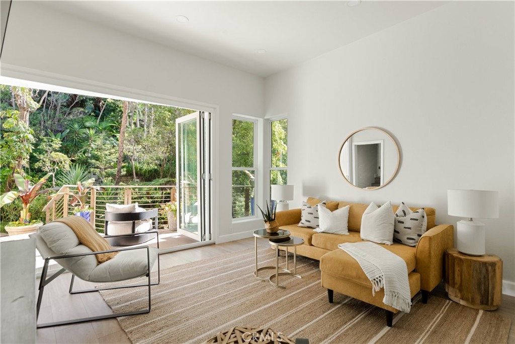 781 Summit Drive Laguna Beach, CA 92651 - Photo 53 of 73 a living room with furniture and a large window