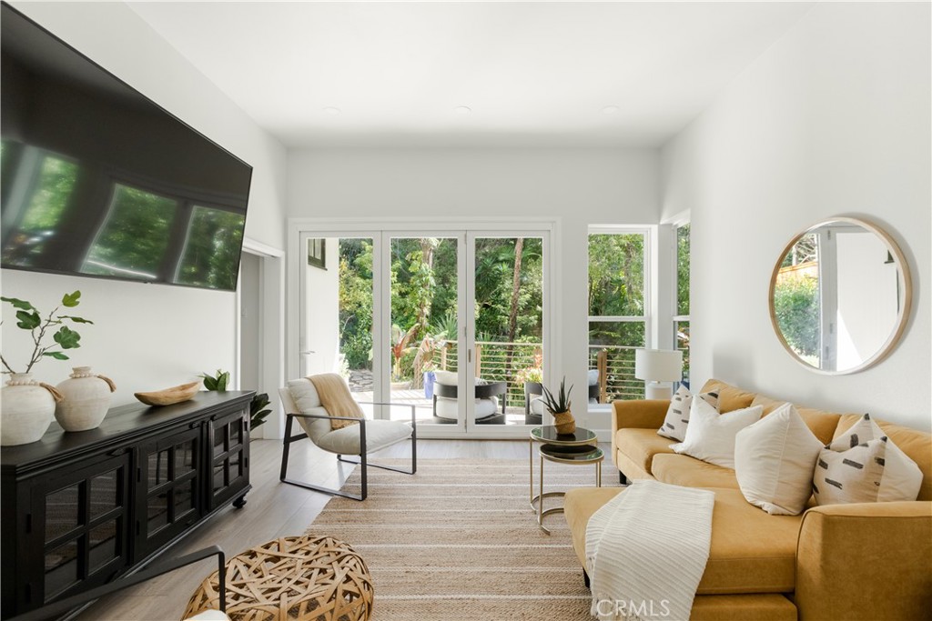 781 Summit Drive Laguna Beach, CA 92651 - Photo 55 of 73 a living room with furniture and a large window