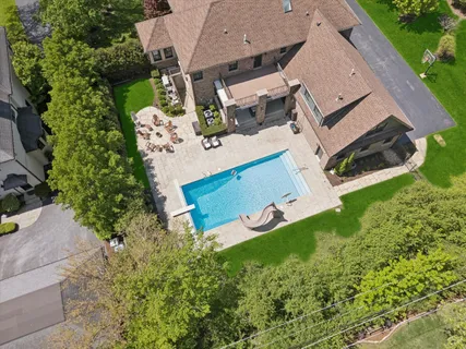 a view of a patio with swimming pool table and chairs
