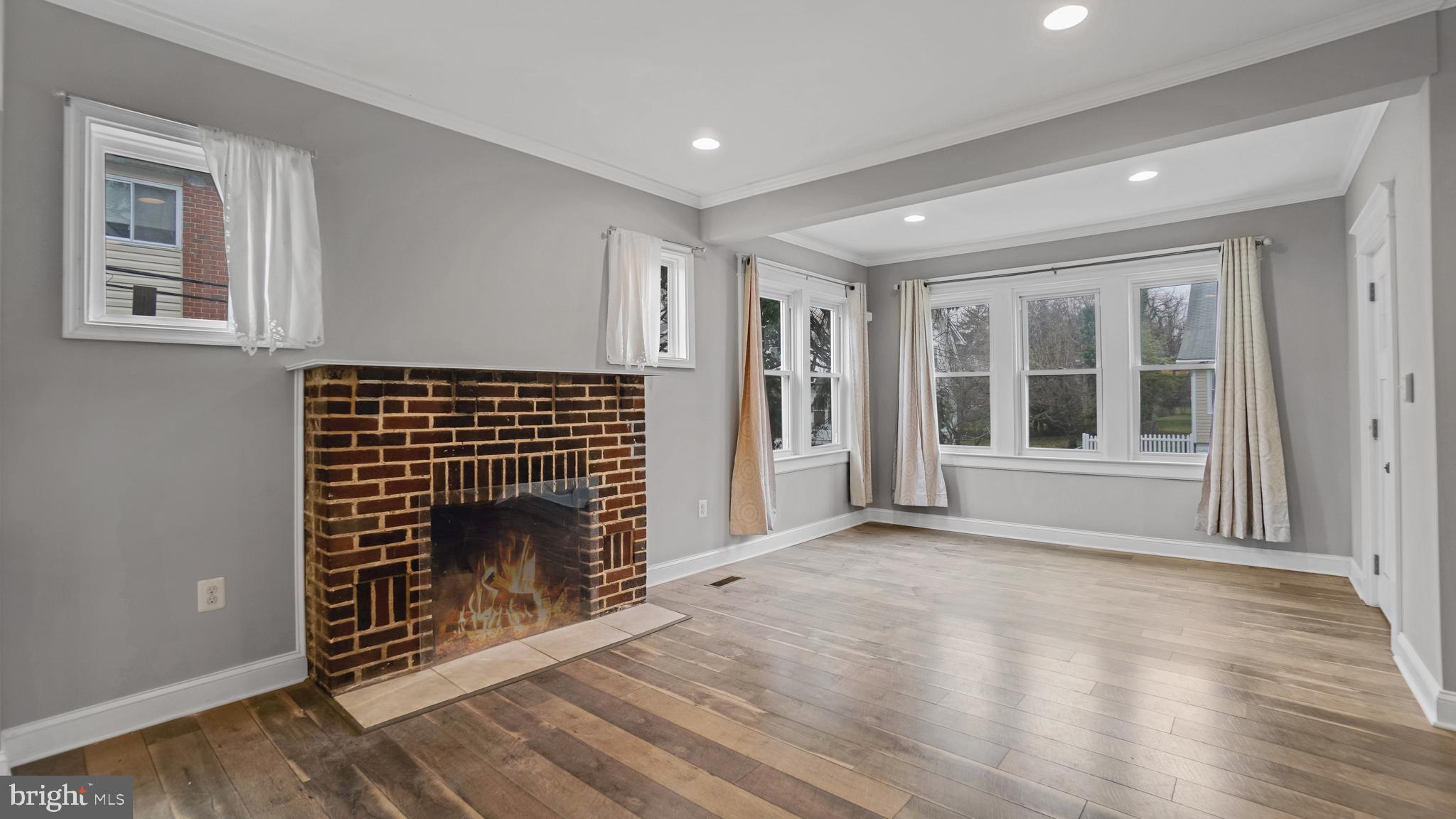 3113 Cedarhurst Road Baltimore, MD 21214 - Photo 9 of 38 Fireplace is there but never used in last 5 years