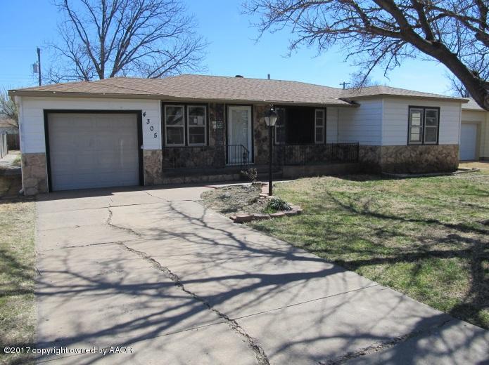4305 South Travis Street Amarillo, TX 79110 - Photo 1 of 15 a front view of house with yard