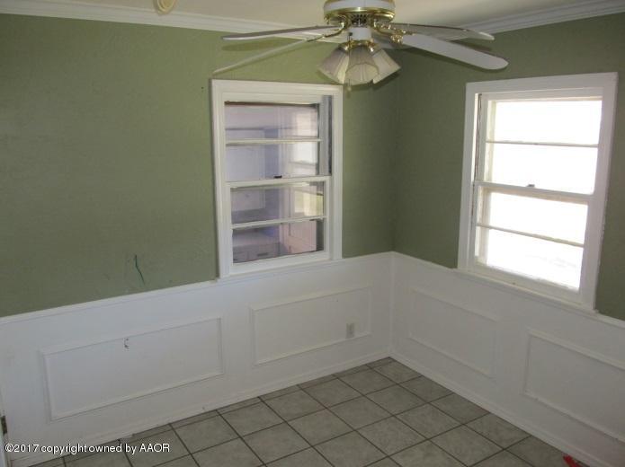 4305 South Travis Street Amarillo, TX 79110 - Photo 7 of 15 a view of an empty room with a window