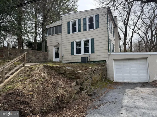 a kitchen with stainless steel appliances granite countertop a refrigerator a sink dishwasher a stove and white countertops with wooden floor