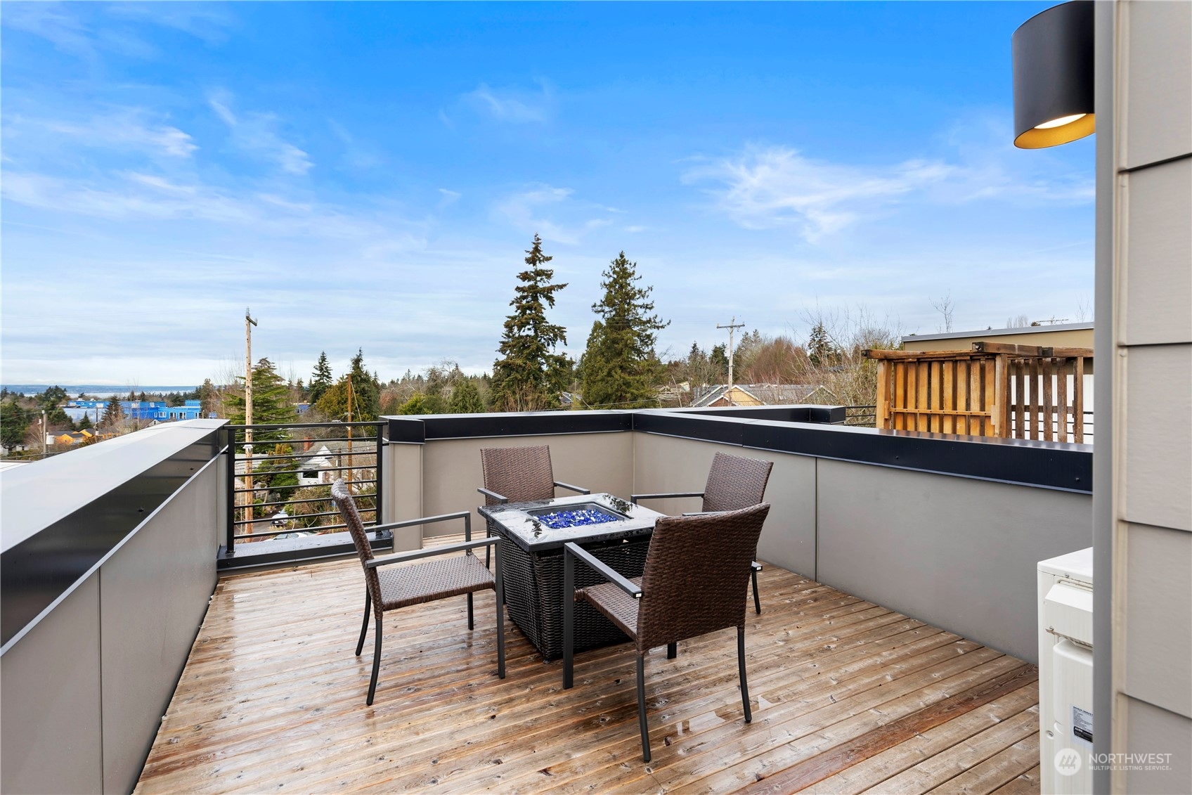 10162 Holman Road Northwest, Unit E Seattle, WA 98133 - Photo 20 of 26 a view of a terrace with furniture and stove