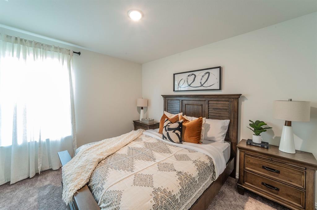 440 Rose Avenue Cleburne, TX 76033 - Photo 11 of 14 a bedroom with a bed and a window