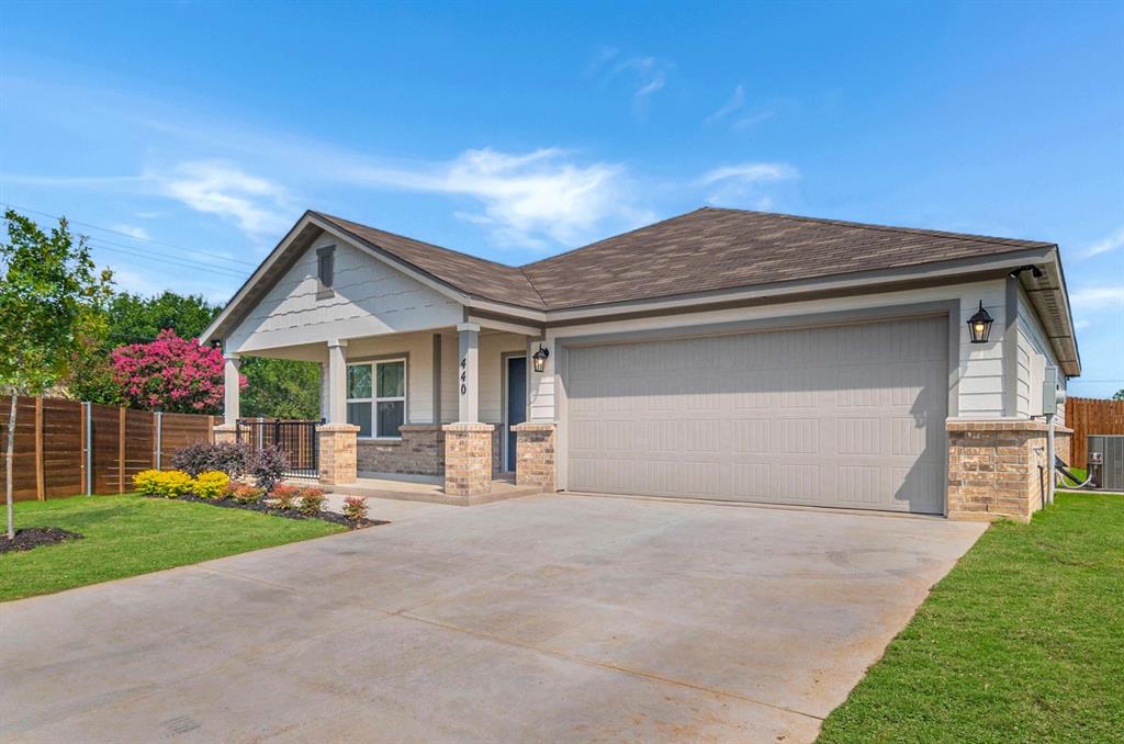 440 Rose Avenue Cleburne, TX 76033 - Photo 2 of 14 a front view of a house with garden