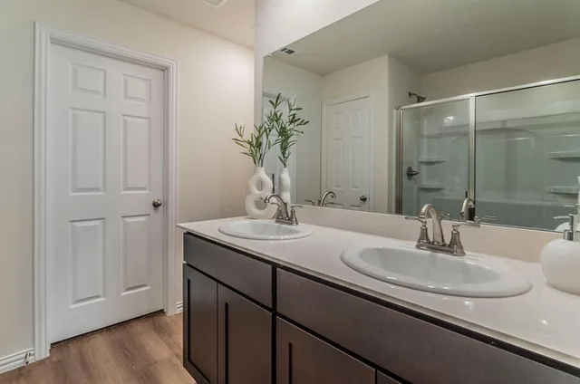 a bedroom with bed and a window