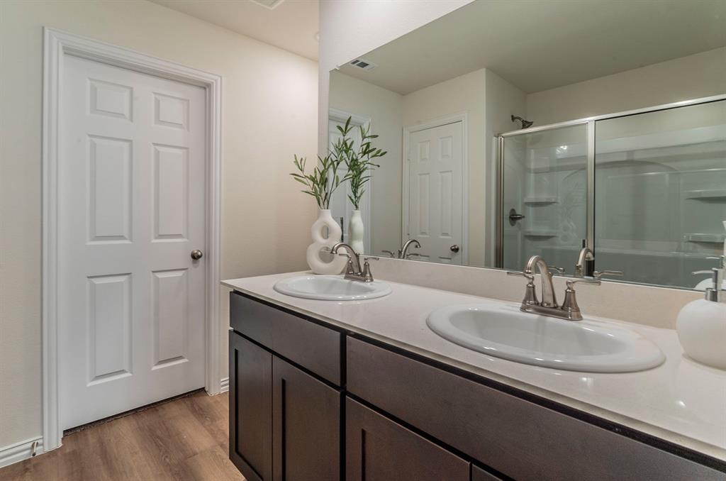 440 Rose Avenue Cleburne, TX 76033 - Photo 8 of 14 a bathroom with a sink and a mirror