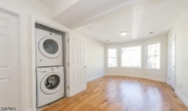 a view of a hallway with washer and dryer