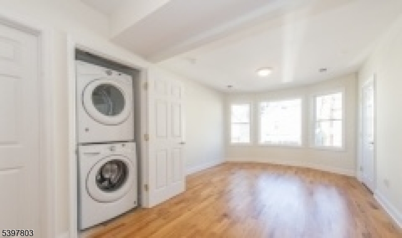 15 Olyphant Place, Unit 2 Morristown, NJ 07960 - Photo 6 of 7 a view of a hallway with washer and dryer