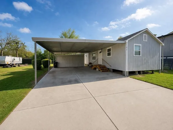 a view of a house with a back yard