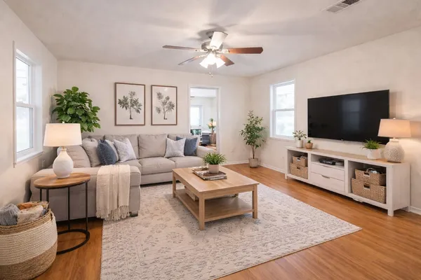 a living room with furniture and a flat screen tv