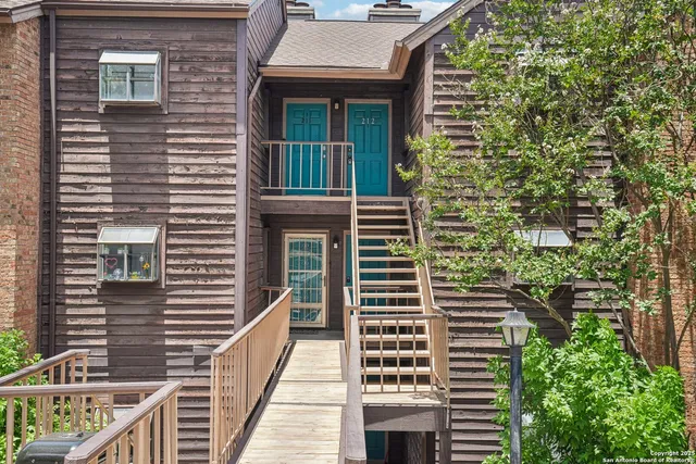 a view of a brick building with many windows