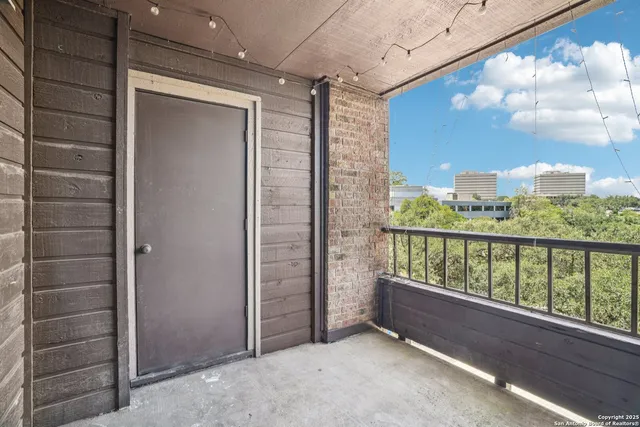a view of a balcony with city view