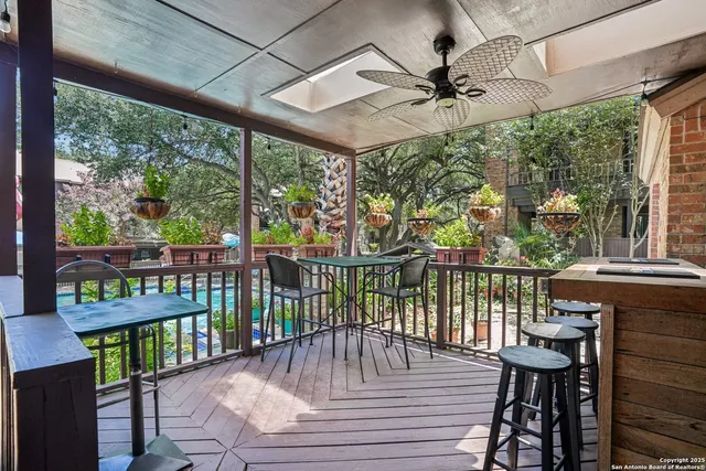 a view of a balcony with furniture