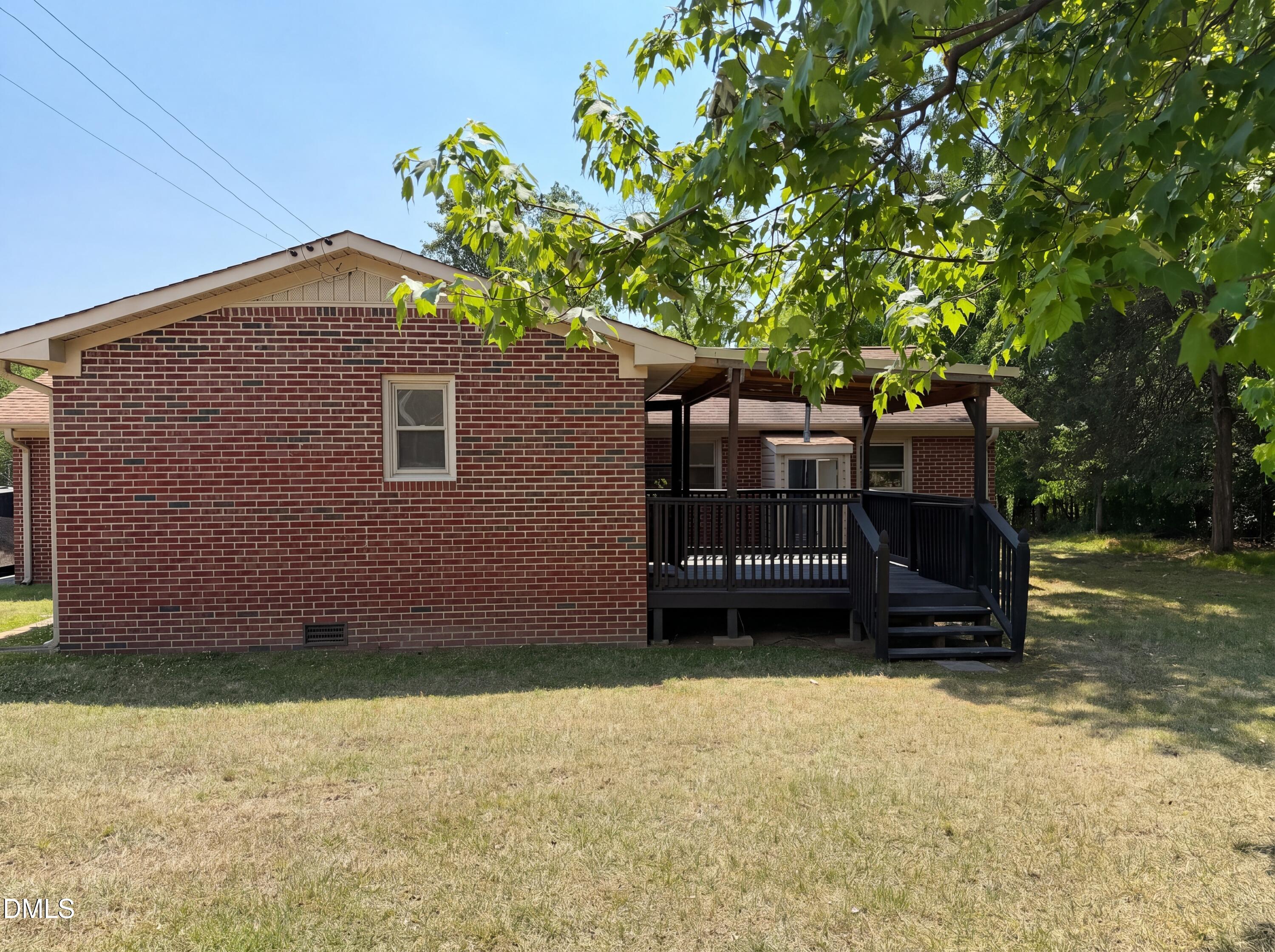 1710 West B Street Butner, NC 27509 - Photo 12 of 14 a house view with a garden space