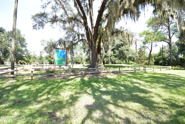 a view of a back yard from a room