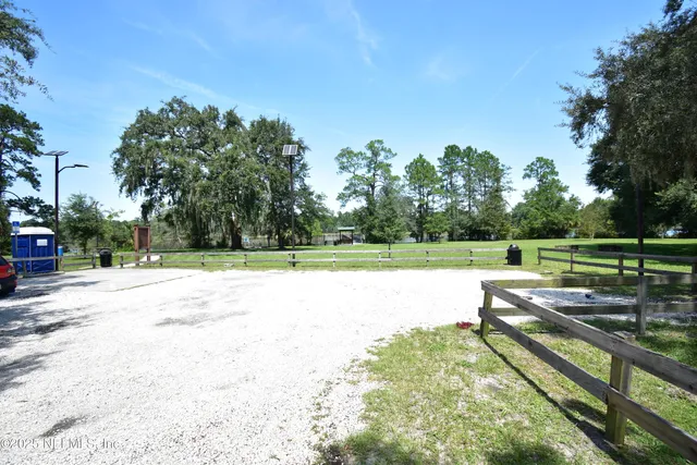 a view of outdoor space with deck and yard