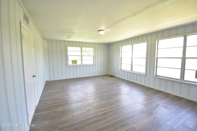 a large kitchen with stainless steel appliances granite countertop a sink stove and refrigerator