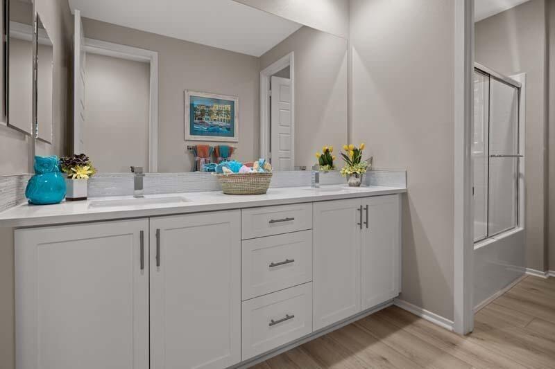 38902 Malva Rosa Drive Palmdale, CA 93551 - Photo 13 of 17 a bathroom with a double vanity sink and a mirror