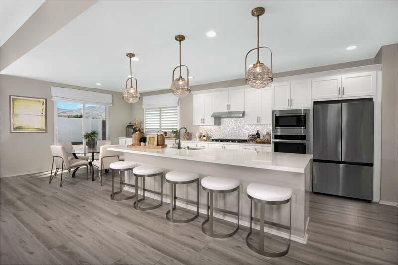 38902 Malva Rosa Drive Palmdale, CA 93551 - Photo 3 of 17 a kitchen with stainless steel appliances a dining table chairs refrigerator and sink