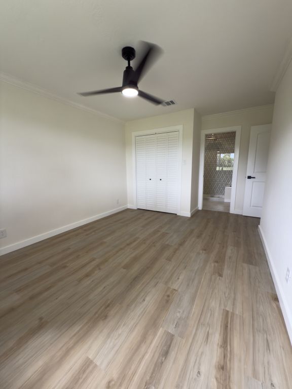 818 Russet Valley Drive Cedar Park, TX 78613 - Photo 11 of 17 a view of an empty room and wooden floor