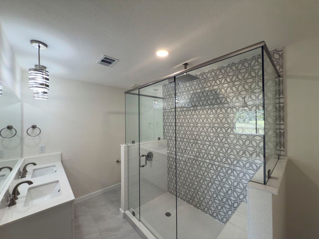 818 Russet Valley Drive Cedar Park, TX 78613 - Photo 2 of 17 a bathroom with a shower and a sink
