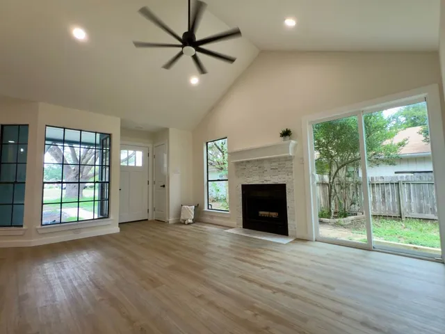 a view of an empty room with a window