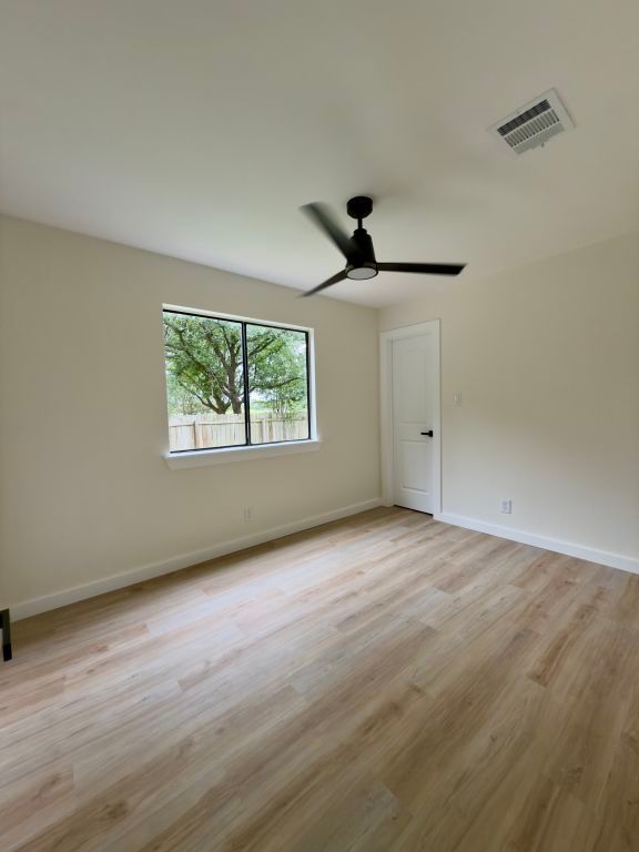 818 Russet Valley Drive Cedar Park, TX 78613 - Photo 9 of 17 a view of an empty room with a window